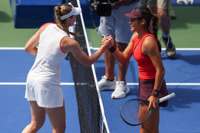 Emma Raducanu, right, shakes hands with Elena Rybakina