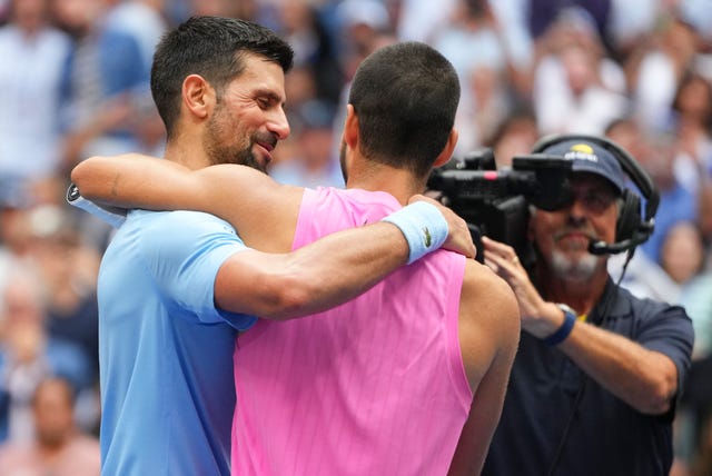 Novak Djokovic and Carlos Alcaraz embrace after the match