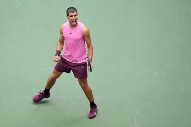 Carlos Alcaraz celebrates after defeating Novak Djokovic