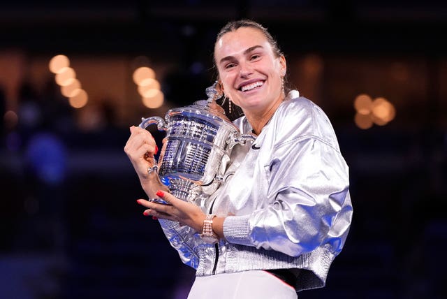 Aryna Sabalenka hugs the US Open trophy 