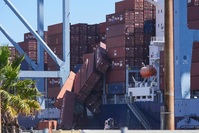 Containers topple off a cargo ship at the Port of Long Beach 