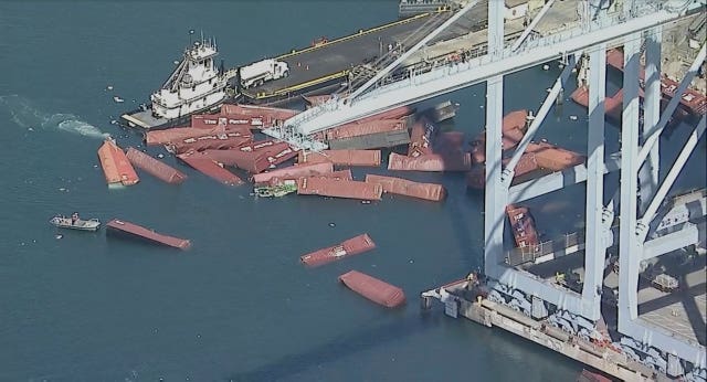 Shipping containers in the water at the Port of Long Beach 