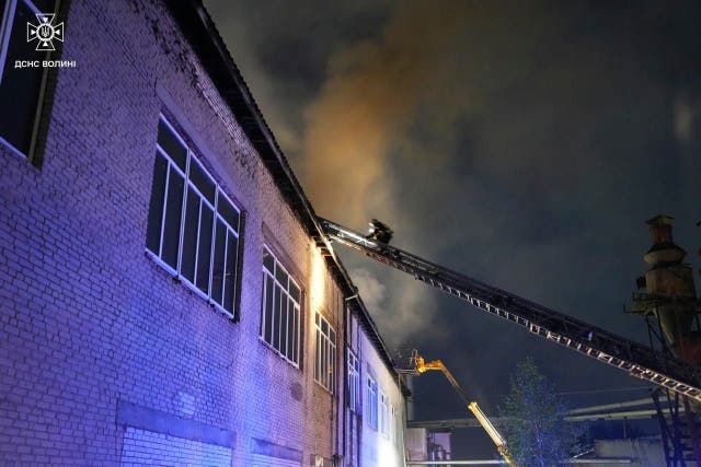 Firefighters tackle a blaze caused by a Russian strike in Ukraine