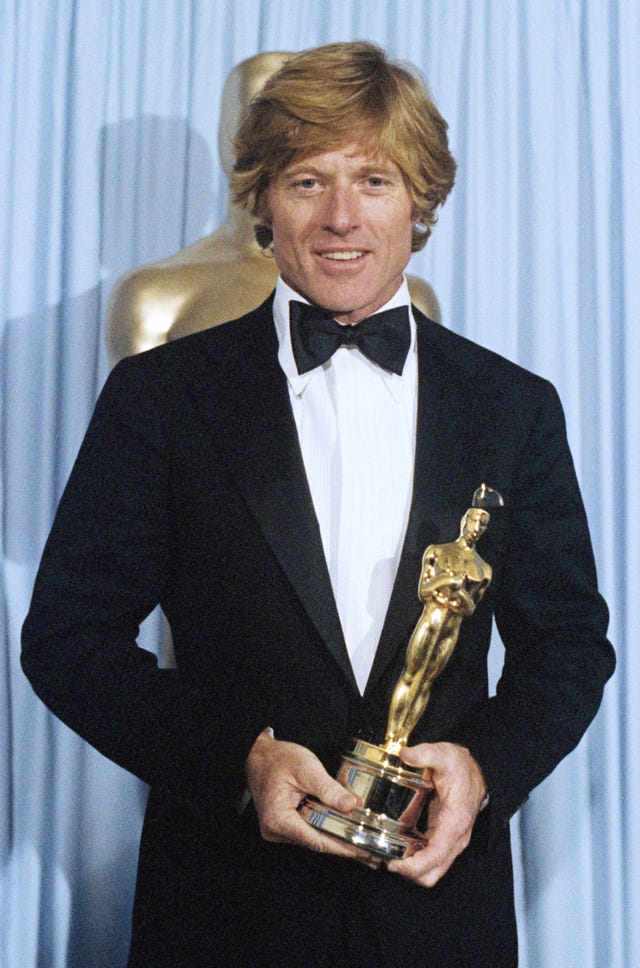 Robert Redford holding his Oscar