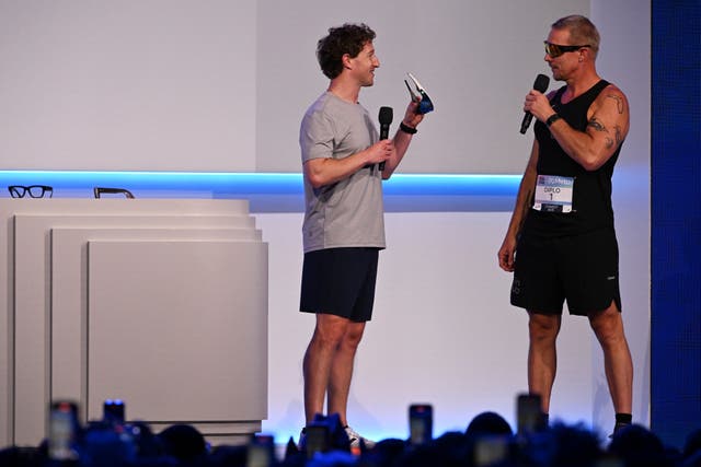 Meta chief executive Mark Zuckerberg, left, talks with DJ Diplo during the conference 