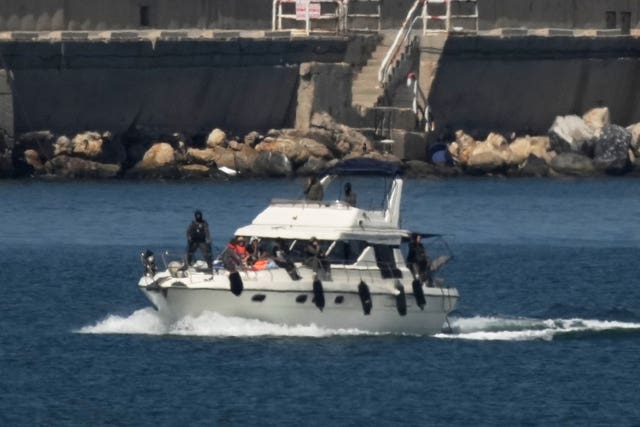 Israeli soldiers sailing a boat