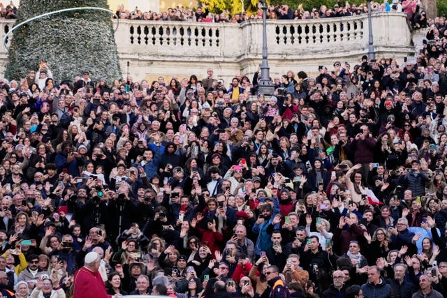 An aerial view of a large crowd of people gathered to see the pope in Rome