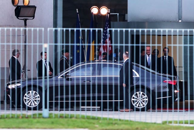 German chancellor Friedrich Merz, right, watches Ukraine’s president Volodymyr Zelensky arriving at the chancellery in Berlin on Sunday 