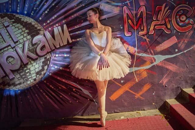 A ballet dancer warms up during the shooting of the Christmas TV show Dancing With The Stars during blackout hours caused by Russia’s regular air attacks on the country’s energy objects in Kyiv, Ukraine