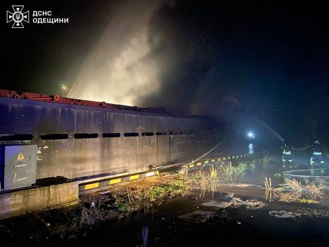 Rescue workers put out a fire of a vessel after a Russian strike on a harbour in Odesa region, Ukraine 