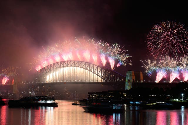Fireworks burst over the Sydney Harbour Bridge during celebrations in Australia