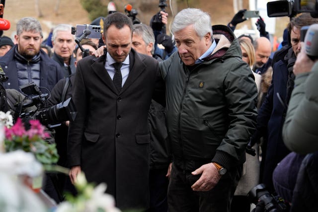 Italian Foreign Minister Antonio Tajani, right, and president of the Valais region Mathias Reynard paying tribute to blaze victims
