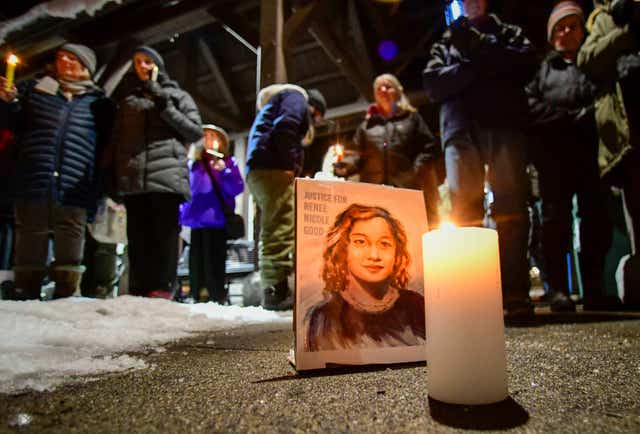 A picture of Renee Good, who was shot and killed in Minneapolis, is displayed during a vigil