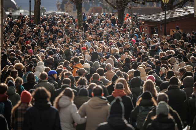 People gather for a minute's silence at Lausanne Cathedral, Switzerland
