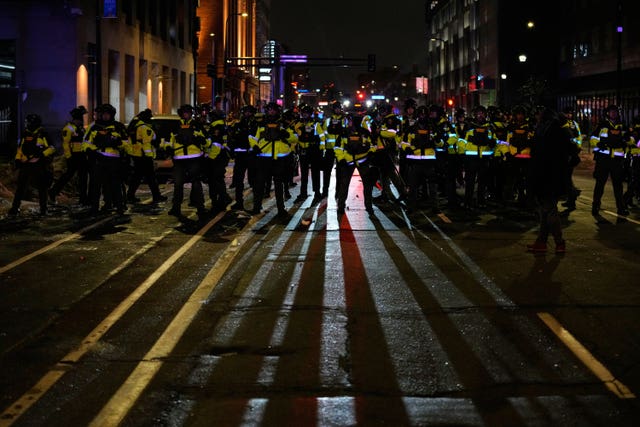 A line of police officers at a protest