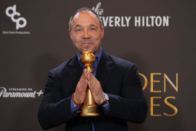 Stephen Graham holding his Golden Globe