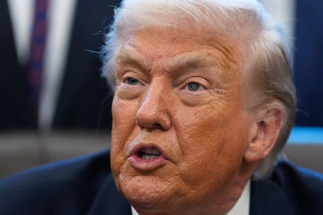 President Donald Trump answers questions from the media