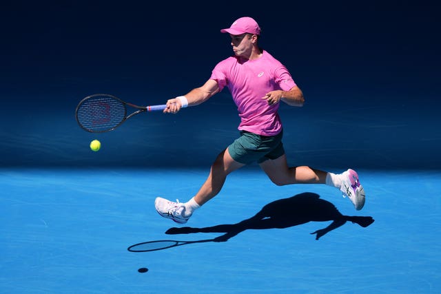 Arthur Fery runs to hit a forehand