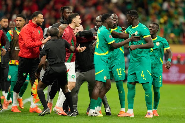 Senegal and Morocco players scuffle after a late penalty was awarded during the Africa Cup of Nations final