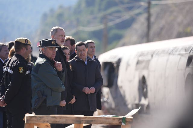 Spain’s King Felipe and Queen Letizia visit the site of the collision 