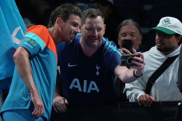 Cameron Norrie poses for a picture with fans 