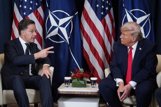 Donald Trump, right, sitting next to Nato secretary-general Mark Rutte
