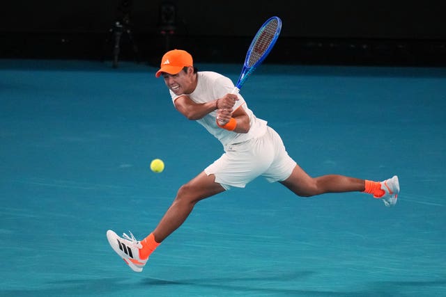 Learner Tien strikes a backhand