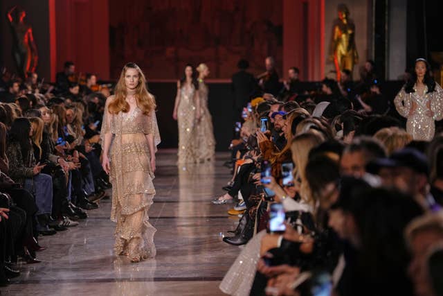 Models wear creations as part of the Elie Saab Spring/Summer 2026 Haute Couture collection presented in Paris