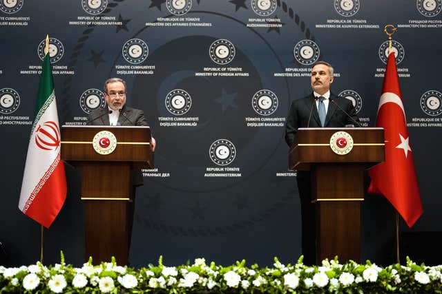 Turkish Foreign Minister Hakan Fidan, right, and his Iranian counterpart Abbas Araghchi during a press conference