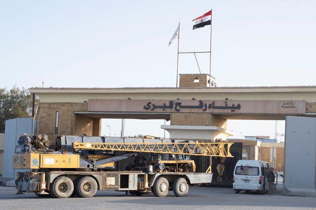 A crane on a lorry passes the Rafah crossing