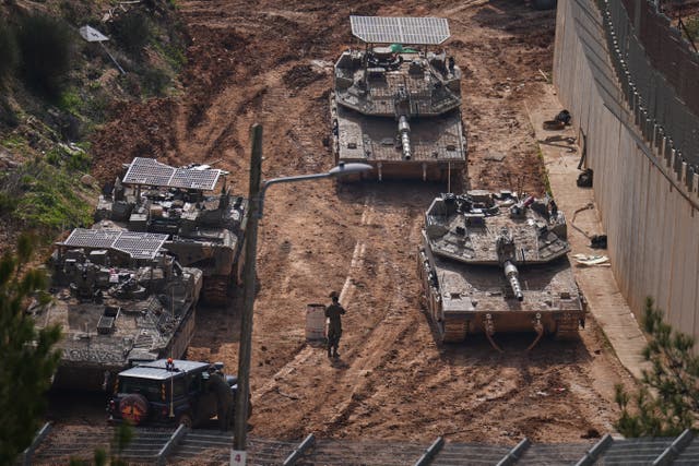 Israeli tanks manoeuvre near the Israel-Lebanon border, in northern Israel