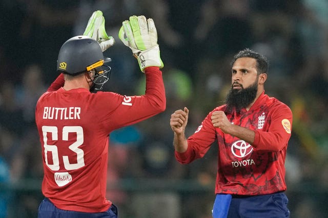 Adil Rashid, right, celebrates a wicket