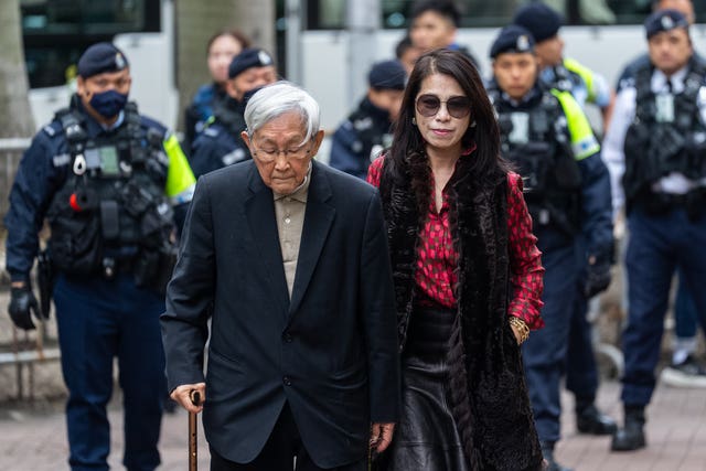 Retired Chinese cardinal Joseph Zen Ze-Kiun, left, and Jimmy Lai’s wife Teresa Lai arrive at the West Kowloon Magistrates’ Courts ahead of the sentencing