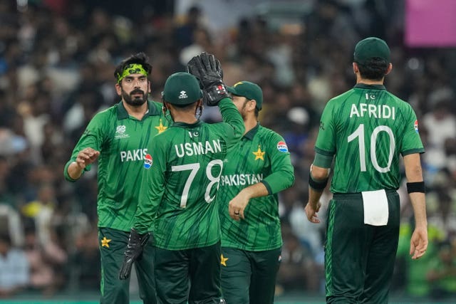 Usman Tariq, left, celebrates with Pakistan team-mates