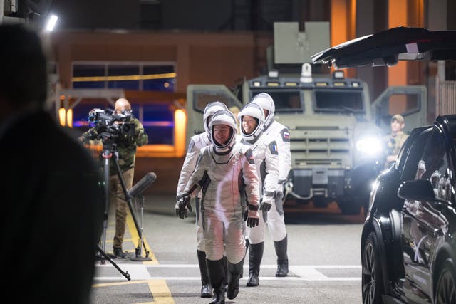 The crew preparing to depart