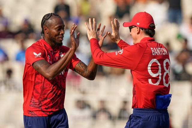 Jofra Archer, left, celebrates taking a wicket