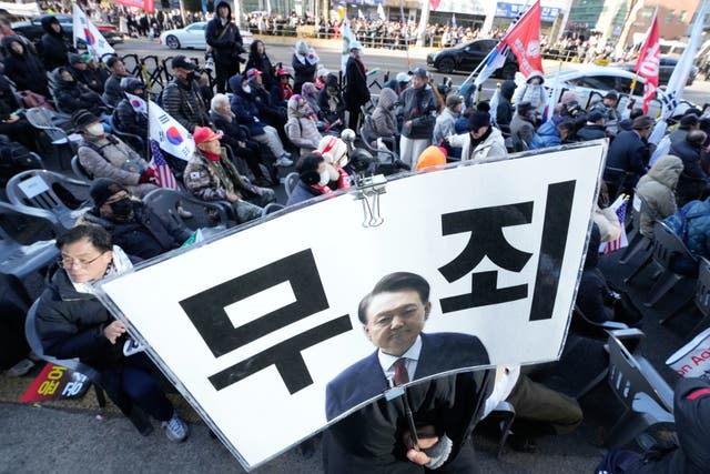 Supporters of the former president Yoon Suk Yeol stage a rally outside of Seoul Central District 