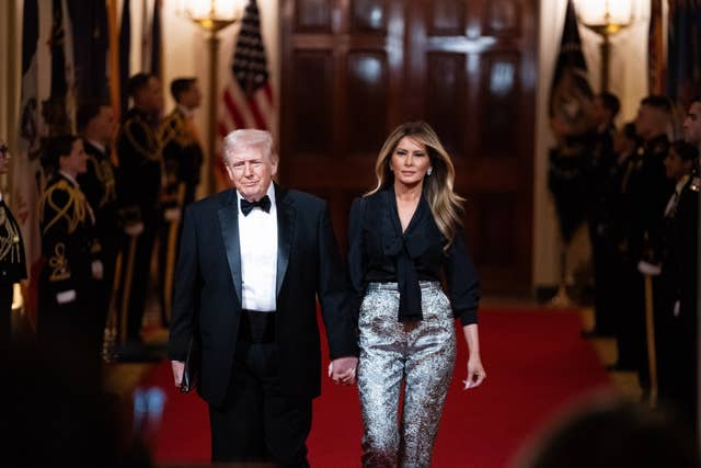 President Donald Trump and first lady Melania Trump arrive at the National Governors Association dinner at the White House in Washington