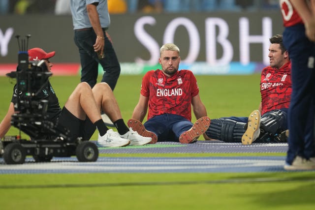 England players sit on the outfield after losing to India