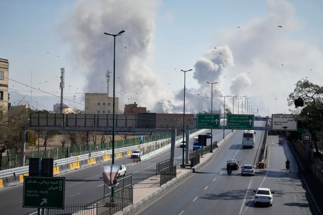 Plumes of smoke rise as strikes hit Tehran on Thursday 