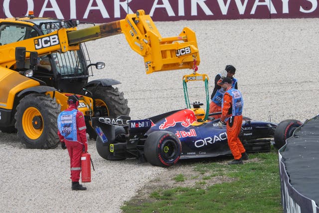 Red Bull driver Max Verstappen of the Netherlands’ car is taken from the track after a crash during the qualifying session for the Australian Formula One Grand Prix at Albert Park