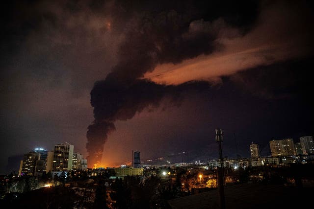 Flames and smoke rise from an oil storage facility in Tehran, Iran