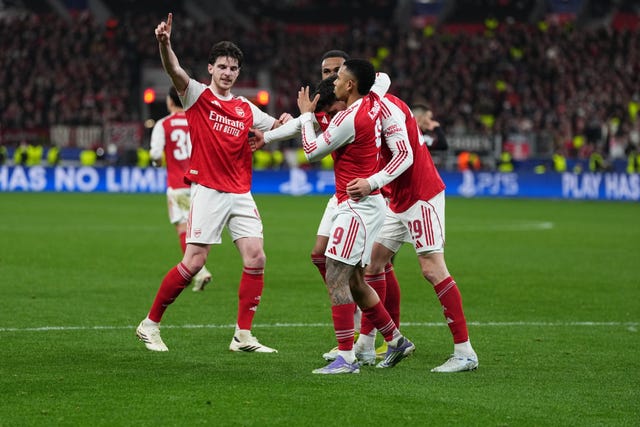 Arsenal players celebrate their side’s first goal