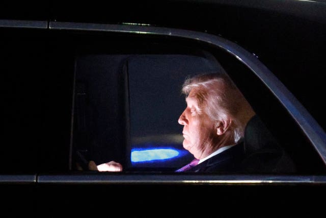 President Donald Trump is seen in his limousine, known as “The Beast,” upon his arrival at Joint Base Andrews