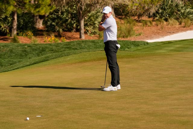 Rory McIlroy watches his putt miss on the second green