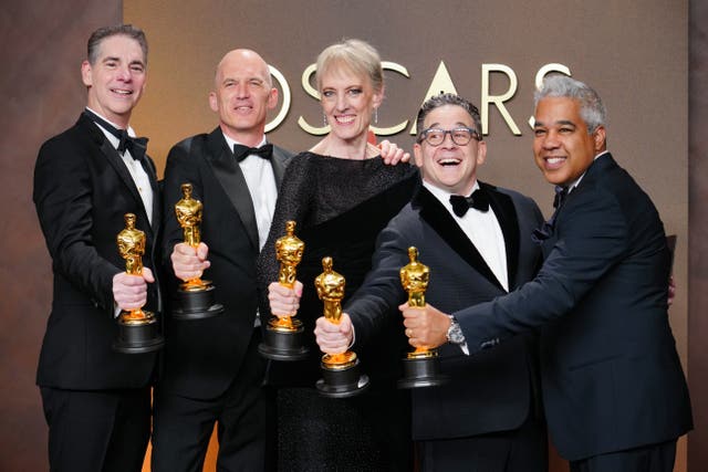 Gareth John, second from left, celebrates his Oscar success with fellow winners