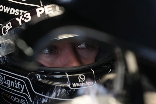 George Russell sits in his car in the Mercedes garage at the Japanese Grand Prix