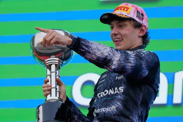 Mercedes driver Kimi Antonelli of Italy reacts on the podium after winning the Japanese Grand Prix