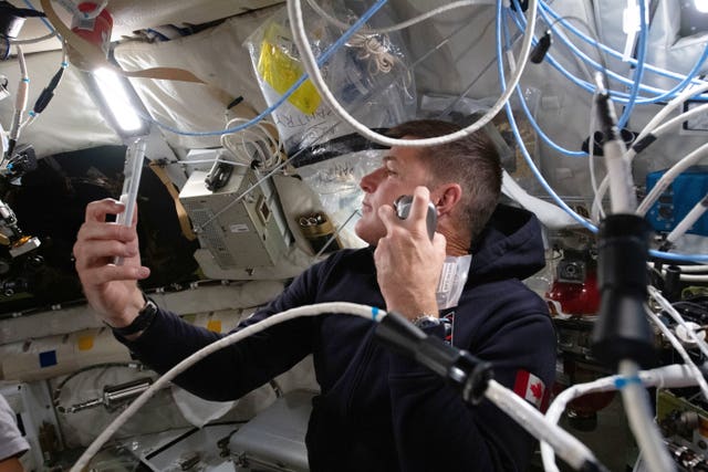 Canadian Space Agency astronaut Jeremy Hansen enjoys a shave inside the Orion spacecraft on day five
