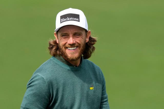 Tommy Fleetwood smiles on the driving range